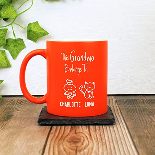 eBuyGB Personalised This Grandma, Nana, Granny, Nanny, Nanna, Gran, Nan Belongs to Mug, Neon 350ml Coffee Cup, Mother's Day Gift, Family Members, Grandchildren, Kids Names, Birthday Present (Orange)