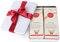 2x Weihnachtstee in Geschenkdose mit roter Schleife – Wintertee Schwarztee „Wintermandel“ & Früchtetee „Schneemützchen“ (je 50 g) von Quertee