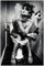 Wallario Poster - Kloparty - Sexy Frau auf Toilette mit Zigarette und Schnaps in Premiumqualität, Größe: 100 x 150 cm XXL-Poster