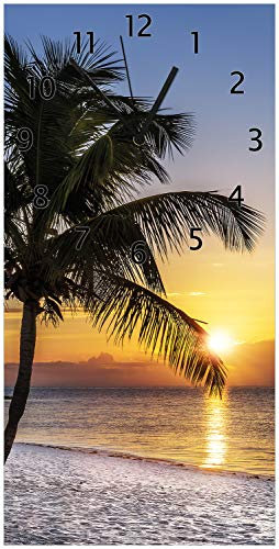 Wallario Design-Wanduhr Palme am Strand - Sonnenuntergang über dem Meer aus Glas, Motiv-Uhr Größe 30 x 60 cm, Schwarze Zeiger