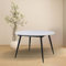 Mesa redonda extensible blanca con patas negras 120x120 cm - Cordelia