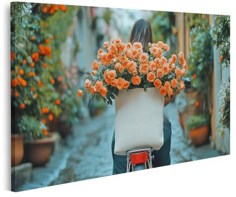 islandburner Bild auf Leinwand Frau auf Fahrrad mit Blumen im Korb fährt durch malerische Straße Bilder Wandbilder Poster