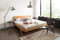 SalesFever Balkenbett JASMIN | 180 x 200 cm | massives Holzbett aus Fichte | natürliche Maserung | geölte Oberfläche | geneigtes Kopfteil | abgeschrägte Holzkufen | FSC® 100%