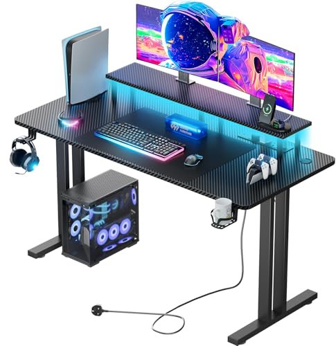 DLONGONE 160 CM Gaming Desk with LED Lights & Power Outlet, Computer Gamer Desk with Monitor Stand, Ergonomic Carbon Fiber Gaming Table Home Office Desk with Cup Holder, Headphone Hook & Mouse Pad