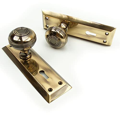 Jones & Grey Bellport New York Solid Antique Brass Round Knobs Door Handles on Keyhole Backplate
