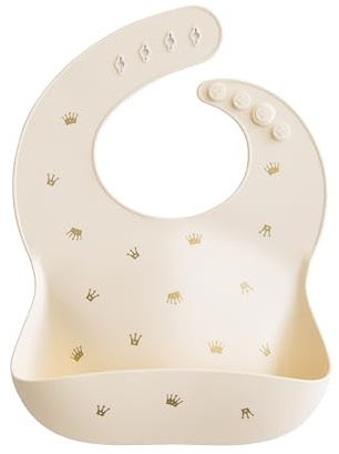 Mushie Baby Silicone Bib | Adjustable Fit Waterproof Bibs | Easy Wipe Baby Feeding Bibs | 4 Adjustable Sizes with Deep Front Pockets | 100% BPA and Phthalate Free (Crowns)