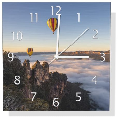 Wallario Design Wanduhr Ballons über Nebelmeer aus Aluverbund, Alu-Uhr Größe 30 x 30 cm, weiße Zeiger mit Metalloptik