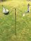 Windspiel-Wippe-Schiff-neben-Leuchtturm-ArtFerro-Handarbeit-Metall-Gartenstecker