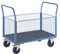 eurokraft | pro | Plattformwagen mit Gitterwänden | Vollelastik-Rollen | 4 hohe Gitter | LxB 1200 x 750 mm