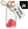 Crottes de licorne de couleur rose qui brillent dans le noir - Pierres phosphorescentes dans une fiole en verre pour cabinet de curiosités - Faux caca, objet humoristique