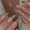24PCS 3D Gold Bronzing Press on Nails – Medium Length Almond Fake Nails with Shiny Textured Design & Gold Lines, Natural Acrylic Nails for Women, Easy to Apply & Remove, Elegant for Any Occasion