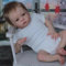Enjoy with Love Neue 22inch Weiche Körper Wiedergeborene lebensechte Wurzelhaar Baby Puppe Oskar Erwachen Baby bereits gemalt fertige Puppe für Kind Geschenk (Brown Eyes)