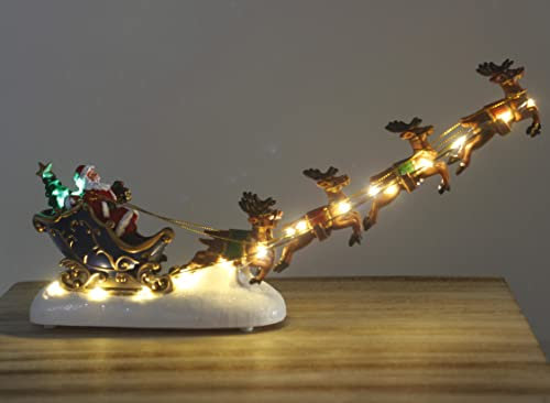 Marco Paul LED Christmas Sleigh & Flying Reindeer Ornament – 31 cm Resin Santa Decoration – Battery-Operated Warm White Light-Up Festive Ornament for Indoor Xmas Home & Village Scene Décor