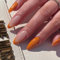 24PCS Short False Nails with Glue Stickers,Almond Full Cover Acrylic and Press on Nails no Glue,Orange French Tip Fake Nails Stick for Women and Girls Nail Art.