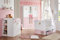 möbel-direkt Babyzimmer Cindy 7 teilig mit 3 türigem Schrank in Weiß und Rosé von Wimex mit Schrank, Bett mit Lattenrost, Umbauseiten und Bettschubkasten, Wickelkommode und Regalen …