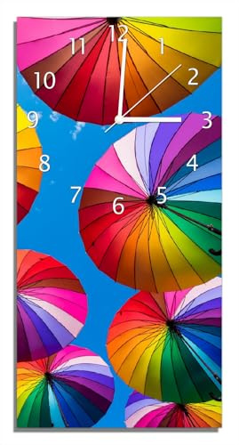 Wallario Design-Wanduhr Bunte Regenschirme vor blauem Himmel aus Glas, Motiv-Uhr Größe 30 x 60 cm, weiße Zeiger
