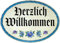Kaltner Präsente Geschenkidee - Holz Geschenkartikel Deko Türschild im Antik Design Dekoartikel Motiv Herzlich Willkommen (Ø 18 cm)