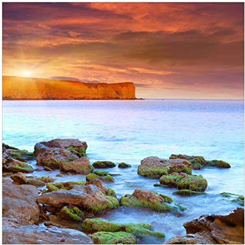 Wallario Glasbild Sonnenaufgang am Meer mit Landzunge und Felsen im Wasser - 55 x 55 cm Wandbilder Glas in Premium-Qualität: Brillante Farben, freischwebende Optik
