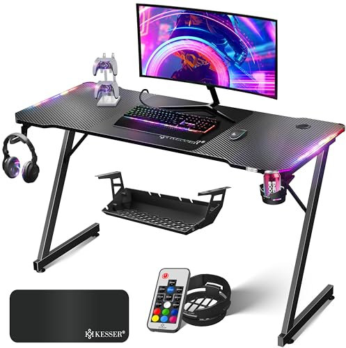 KESSER® Gaming Tisch LED 140cm x 60cm | Z-Form Gamer Schreibtisch | Kopfhörerhaken & Kohlebeschichtung | Ergonomischer PC Computertisch | Stabiler Tisch & Getränkehalter Schwarz