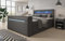 Luxusbetten24 Boxspringbett Rinori 140x200 Doppelbett Polsterbett Bett mit TV Lift, USB, LED und Stauraum | Bezug: Kunstleder | Farbe: Grau | Härtegrad: H4 (100kg+)