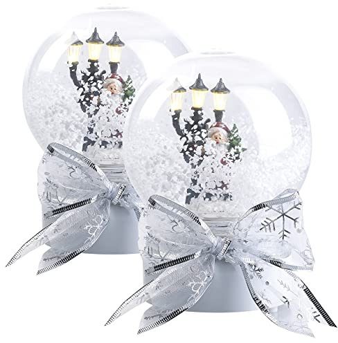 infactory 2er-Set Schneekugeln mit singendem Weihnachtsmann, LED-Laterne