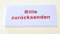 Haftnotiz mit dem Druck Bitte zurücksenden