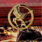 1 pin's The Hunger Games Katniss Everdeen avec jeton oiseau