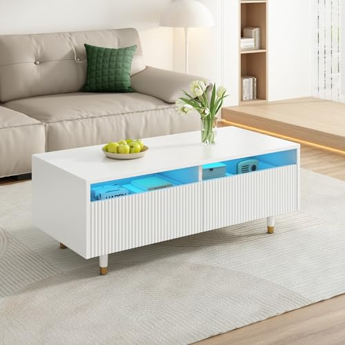 Dieser moderne LED-Couchtisch verfügt über eine gewellte Schubladenplatte, gold-weiße Beine,zwei Schubladen und einen farbwechselnden LED-Lichtstreifen.Ein passender TV-Schrank ist ebenfalls erhältl
