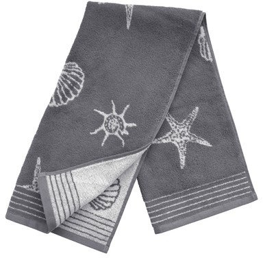 Frottee-Handtuch mit Muscheln und Seesternen.