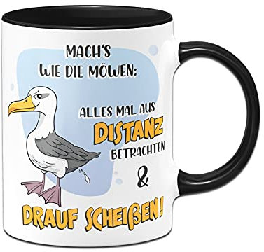 Tassenbrennerei Original - Tasse mit Spruch: Mach´s wie die Möwen Alles mal aus Distanz betrachten und drauf scheißen - Kaffeetasse lustig - Geschenk Kollegin (Schwarz)
