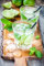 Acryl-Bild 70 x 110 cm: Zwei kalte Mojitos-Cocktails auf rustikalem Holztisch (44262760)