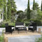 Imora Gartenmöbel-Set aus geflochtenem Kunstharz, Schwarz, komplettes 4-Sitzer-Lounge-Set mit Kissen, Ecru – 1 2-Sitzer-Sofa + 2 Rattan-Sessel + 1 Couchtisch