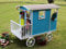 SOULET Carry Wooden Shepherds Hut Playhouse for Kids - 6x8 FT - Eco-Friendly Outdoor Children's Hut with Waterproof Roof, Polycarbonate Glazing, and Decorative Wheels