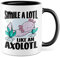 Tasse Lächeln Geschenk, Smile a lotl. Like an axolotl Geschenkidee Kaffeetasse mit Spruch lustig Kaffee-Becher Lächeln Lacheln Grinsen Humor Witztasse (Weiß/Schwarz)