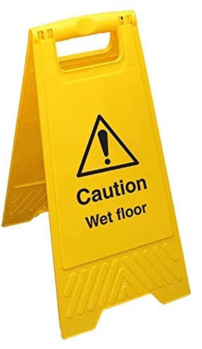 Letrero amarillo de doble cara con texto en inglés Caution Wet Floor