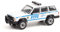 Collectibles Greenlight 42960-C Hot Pursuit Series 38 - 1997 Jeep Cherokee NYPD Maßstab 1:64 Modellauto für Erwachsene und Sammler, Weiß mit Blauen Akzenten, limitierte Auflage, in Acryl-Vitrine