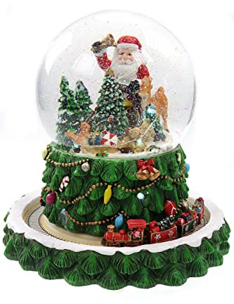Schneekugel/Spieluhr Tannenbaum ⌀150mm, weihnachtlicher Sockel mit rotierendem Zug, Musik, Licht & Schneeantrieb, H: 23,5cm