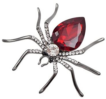 Brosche mit Spinne, versilberter Stahl und rotem Kristall., Metall