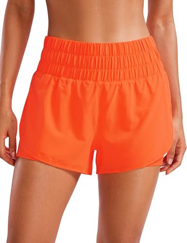 CRZ YOGA Damen 2 in 1 Running Shorts High Waist Schnelltrocknend Atmungsaktiv Sporthose Laufhose Laufshorts mit Tasche Neon Orange 38