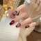 MouyouGlow Press on Nails Long, Ballerina Black Gradient Red Fireworks Cat Eye Magnetic New Year Fake Nails with Nail Glue, New Year Phototherapy Art Artificial Fingernails, Pack of 10 (85-S Size)