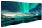 Bild auf Leinwand Aurora über verschneite Berge, Sandstrand mit Steinen. Nordlicht auf den Lofoten, Norwegen. Sternenhimmel mit Polarlicht. Nächtliche Winterlandschaft mit grünem P