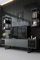Dmora - Meuble TV Kaus, Buffet de Salon, Armoire Basse pour TV, Base Murale de Rangement, 180x30h48 cm, Anthracite et Noir
