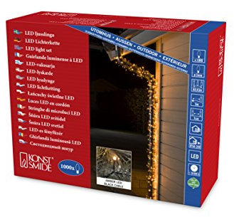 Konstsmide Micro LED Lichterkette, 1000 bernsteinfarbene Dioden, 24V Außentrafo, schwarzes Kabel - 3648-800