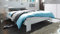 Möbel Akut Futonbett Vega Bett in weiß und Beton mit Rollrost und Matratze 140x200 cm