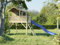 Prestige Garden Stelzenhaus Funny XXL KDI | 285x188x303 cm | Kesseldruckimprägniertes Kiefernholz | Mit Veranda, Balkon & Blauer Rutsche | 146 cm Podest | Kinder Outdoor Spielhaus