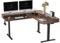 FEZIBO 160 x 140 cm L Shaped Corner Stand up Electric Height Adjustbale Standing Desk with 4 Drawers, with Splice Board, Black Frame/Black Walnut Top