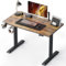 FEZIBO Schreibtisch Höhenverstellbar Elektrisch, 110 x 60 cm Stehschreibtisch mit Memory-Steuerung und Anti-Kollisions Technologie, Schwarz Rahmen/Rustikales Braun Tischplatte