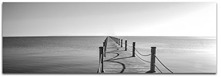 Paul Sinus Art Panoramabild auf Leinwand und Keilrahmen 150x50cm Meer Holzsteg schwarz/weiß