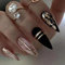 JUSTOTRY 24 Pcs Rose Gold Swirl False Nails Short Pattern,Black Almond Press on Nails,Pretty French Oval Stick on Nail for Women Gifts,Glossy Glitter Fake Nail Medium for Nail Art