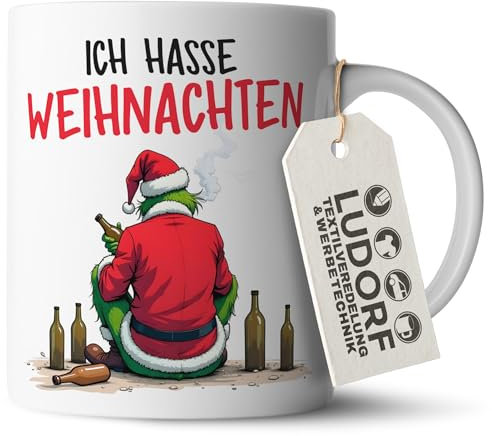 #teamludorf - Grinch Weihnachtskaffeetasse - Weißer Henkel, Keramik 300 ml, hochwertiger Druck, spülmaschinenfest - Festliche Kaffeetasse für Zuhause, Büro oder als Geschenkidee